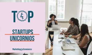 Persona hablando a tres oyentes en una reunión de oficina; a la izquierda, texto: "TOP STARTUPS UNICORNIOS, Marketing4eCommerce". Encuentro innovador.