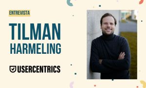 Imagen de entrevista en la que podemos ver una foto de Tilman Harmerling justo a su nombre y el logo de su empresa, Usercentrics.